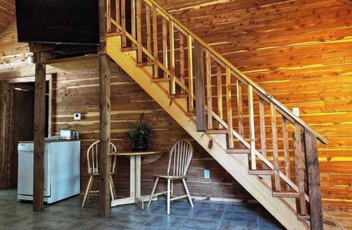 Mid America Cabin | Located directly on the water — private boat slip, boat ramp, and swim area.