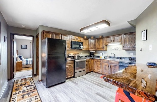Wildernest Condo | Lofty condo with beautiful mountain & lake views plus wood fireplace