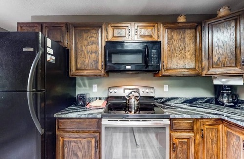 Wildernest Condo | Lofty condo with beautiful mountain & lake views plus wood fireplace