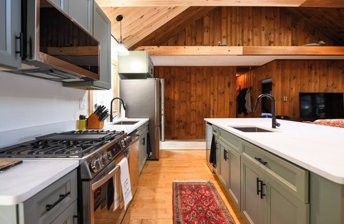 Harrison House | Long Lake cottage with spacious screened porch and excellent sunset views!