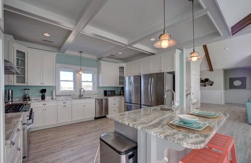 Avon House | Lovely beachfront home with hot tub, pool, game room, & central AC