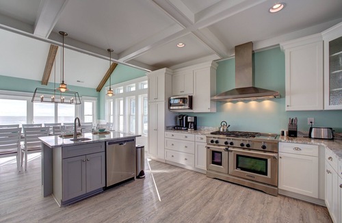 Avon House | Lovely beachfront home with hot tub, pool, game room, & central AC
