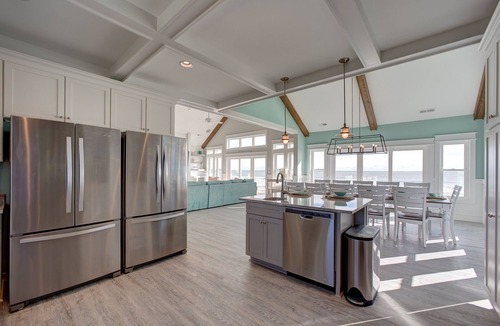 Avon House | Lovely beachfront home with hot tub, pool, game room, & central AC