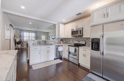 South Palm Park Neighborhood Association House | Lush Tropical Oasis! HEATED Pool, 1 mile to downtown, 2 miles to public beach