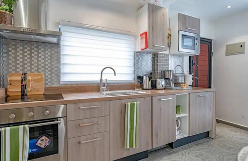 Cantonments Condo | Luxe rooftop studio in Cantonments steps away from Nekter lounge w/pool & gym