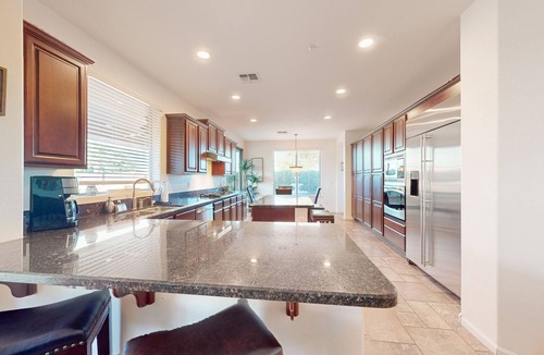 Seville House | Luxe snowbird-friendly haven with heated pool, gas fireplace, balcony, & firepit