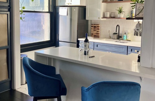 East Village Condo | Luxe Suite one bedroom condo with free parking, balcony and partial ocean view.