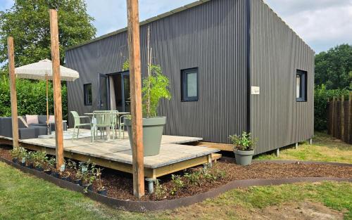 Schin op Geul House | Luxe Tinyhouse Saffraan met privé hottub