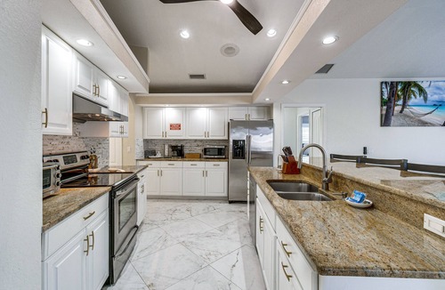 Gulf Cove House | Luxe Waterfront Oasis w/Dock, Heated Pool & Spa!