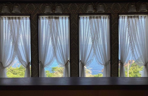 Hamada House | Luxrious double room with mountain view and ocean view from the balcony and an interior window/Hamada Shimane