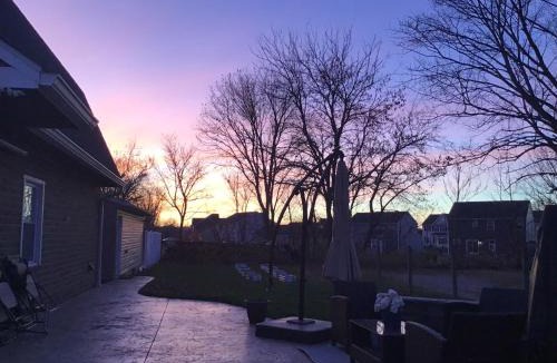 Greentown House | Luxurious 1875 centrally located Canton Akron home, expansive primary & sunset view