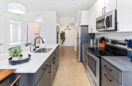 Carag Apartment | Luxurious 2BR Retreat near Downtown Roofdeck & Gym
