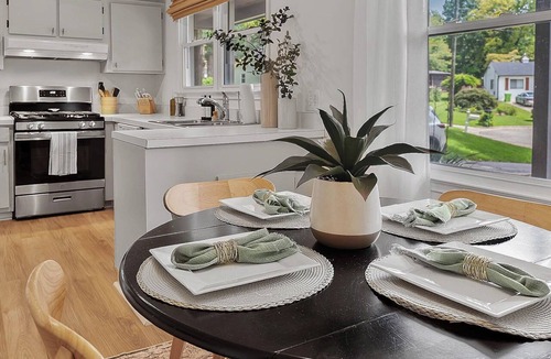 Eastgate House | Luxurious 4BD near Downtown and RDU, with sunroom, theatre, games, & more!