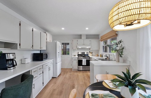 Eastgate House | Luxurious 4BD near Downtown and RDU, with sunroom, theatre, games, & more!