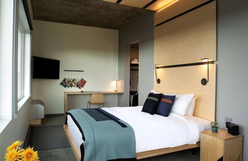 River North Art District Hotel | Luxurious King Room with Breathtaking Mountain Views and Modern Elegance