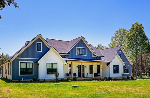Louisa House | Luxurious lakeside home with private dock, beach, patio, & game room - dogs OK