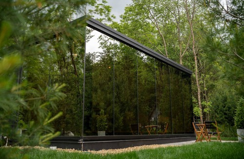 Pepin Cabin | Luxurious mirrored cabin nestled on the Woods & Co Weddings + Events property for the ultimate getaway