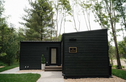 Pepin Cabin | Luxurious mirrored cabin nestled on the Woods & Co Weddings + Events property for the ultimate getaway