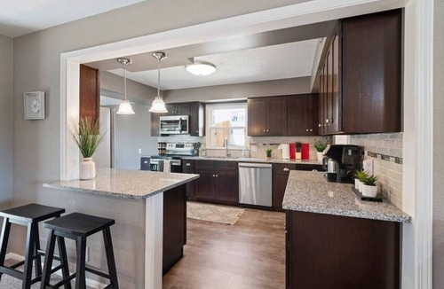 South Kansas City House | Luxurious Poolside Escape on 106th Street: Your Private Oasis in Kansas City
