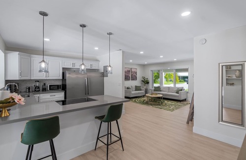 Garden Isles House | Luxurious Waterfront Ocean Access Heated Pool WD Wifi 75Ft Dock Bring Your Boat