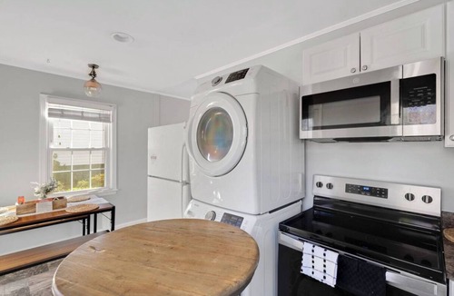 East Raleigh House | Luxury 2BD Home, Coffee, Games, Outdoor Seating, Close to Airport, Hospitals