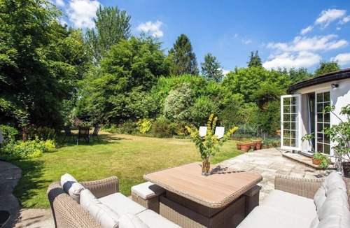 Caterham House | Luxury family home in Surrey, UK with garden, pool table, fireplace & playground