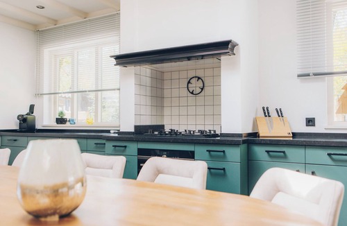 Lieren House | Luxury group accommodation with stylish interior, modern comforts, five bedrooms, spacious kitchen and garden, ideal for a relaxing stay.