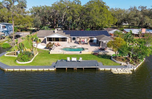 Seffner Community Alliance House | Luxury Hideaway - Lakefront - Mini Golf, Pool + More!