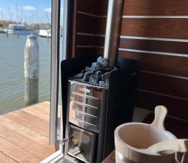 Monnickendam Boat Rental | Luxury Houseboat Liberdade with sauna and dinghy