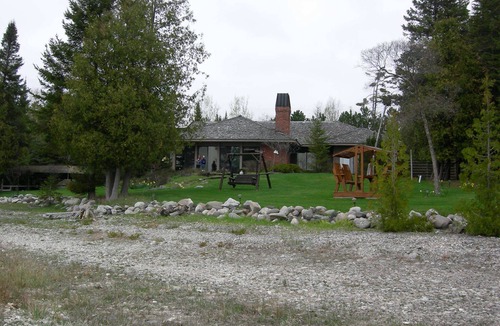 Charlevoix House | Luxury Lakefront Property with private dock, tennis court, trails & views