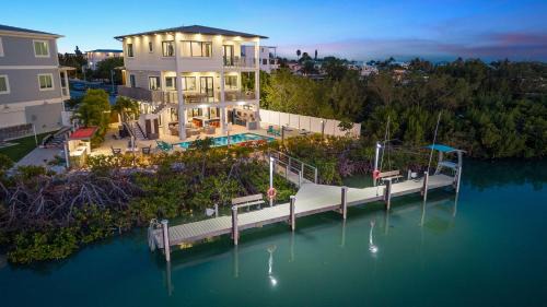 Marathon House | Luxury Seaside Escape ~ Heated Pool w Jacuzzi ~ Elevator ~ Dock ~ Scenic Views