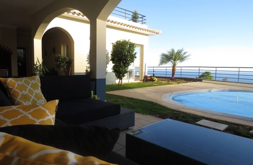 Arco da Calheta Villa | Luxury villa with private heated pool, garden and views of the sea and mountains