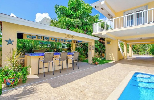Twin Lakes House | Luxury Water Front Home, Private Pool, Spa, Tiki Bar, 36' Foot Dock with Kayaks