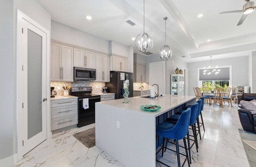 Palm Harbor House | Luxury Waterfront Home Heated Pool Dock Bikes