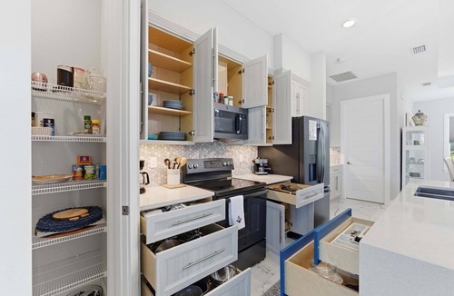 Palm Harbor House | Luxury Waterfront Home Heated Pool Dock Bikes
