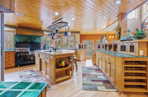 Three Rivers Ski Chalet | Majestic Riverfront Chalet is set down a serene and private drive.