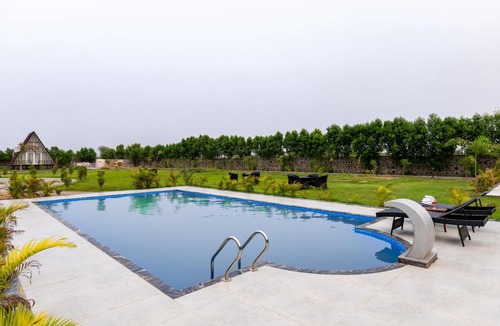 Faridabad Villa | Malik Farms Countryside Wooden Cottage on 2 Acre Estate with Shared Pool, Garden & Restaurant