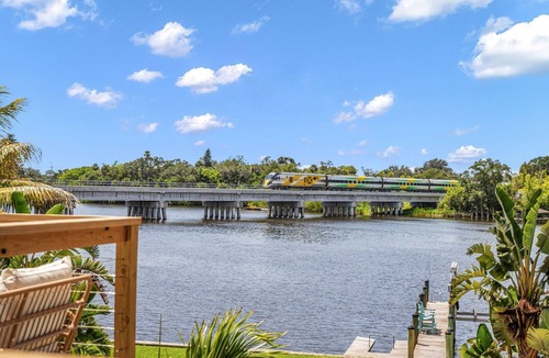 Tropic House | Mango Shores: Trendy Riverfront House w/Game Room, Speakeasy & Pool!