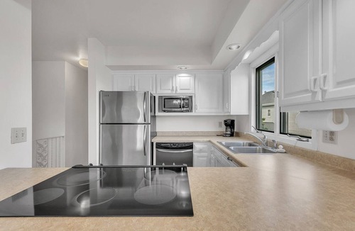 Algoma Condo | Marina-Front Retreat - Steps to Beach, Wine & Water
