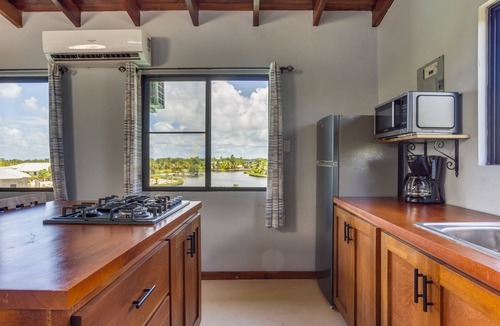 Cocoplum House | Maya Beach: Two Bedroom Lagoon View Apartment