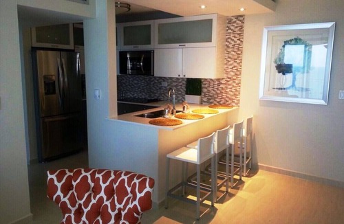 Oriente Apartment | MB15- Beachfront 1 Bedroom balcony-washer & dryer