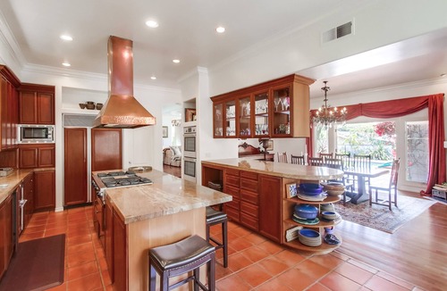 Muirlands Villa | Mediterranean magic in a sun-kissed tropical oasis with pool and pizza oven.
