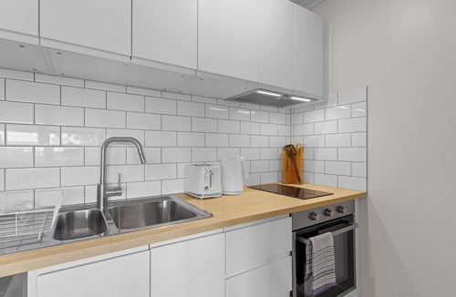 Spring Hill Apartment | Mediterranean Style Steps from the CBD