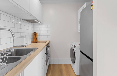 Spring Hill Apartment | Mediterranean Style Steps from the CBD