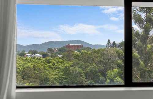 Spring Hill Apartment | Mediterranean Style Steps from the CBD
