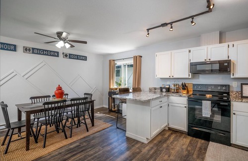 Kalispell House | Mid-Way on 3rd, Sleeps 10, Sauna and Firepit with tow living rooms and fenced back yard