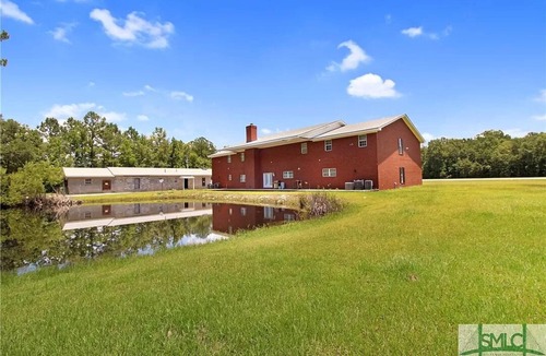 Fleming House | Midway Manor Awaits You with 7 bedrooms, 5 Bathrooms, and Unlimited Charm
