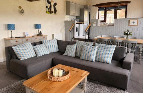 Castle Carrock House | Mill Barn, Castle Carrock, dogs welcome, hot tub with countryside and reservoir views