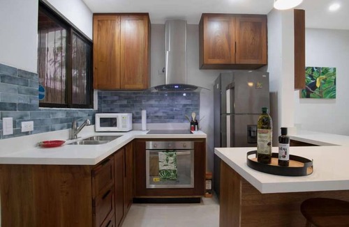 Coco Apartment | Minimalist Condo with a Beautiful New Design, Enclosed Patio, and Shared Community Pool