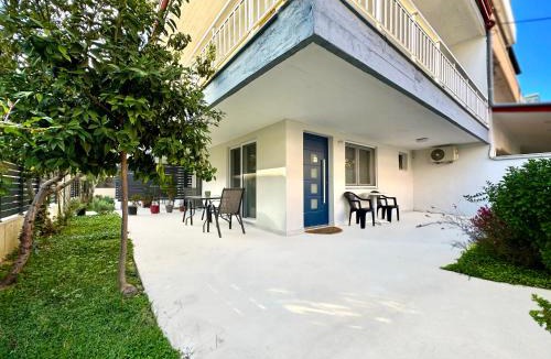 Olymbiaki Akti House | Minimalist Seaside Apartment with Private Patio and Parking - Blue Zone Homes